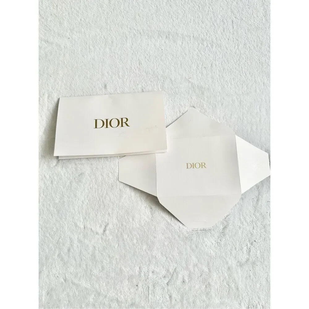White and gold Dior envelope ￼